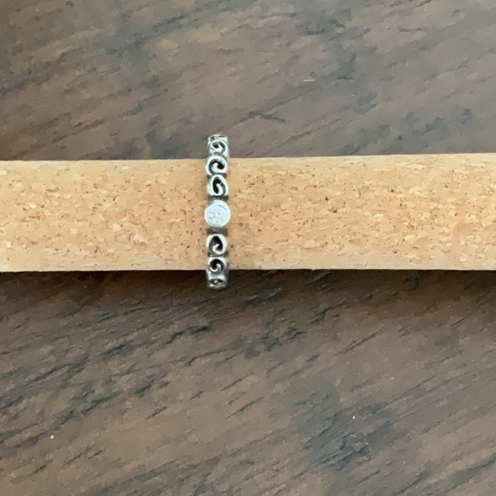 Pandora swirl ring with clear stone